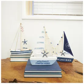 BLUE RESIN SAIL BOAT SCULPTURE WITH NETTING AND STARFISH DETAILS